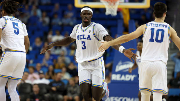 Nov 6, 2023; Los Angeles, California, USA; UCLA Bruins forward Adem Bona (3) celebrates with guard Lazar Stefanovic (10) during the second half against the St. Francis (Pa) Red Flash at Pauley Pavilion presented by Wescom. Mandatory Credit: Kiyoshi Mio-USA TODAY Sports
